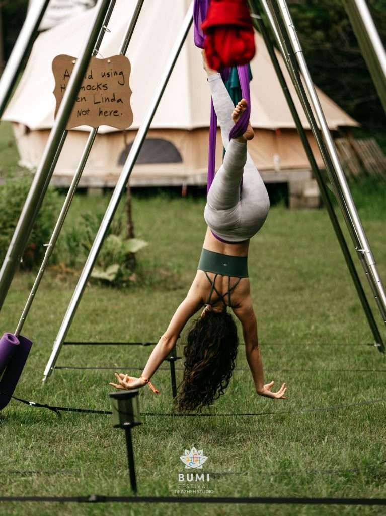 Bumi Festival 2024 Linda Aerial Yoga Instructor Guides participants in yoga that defies gravity.